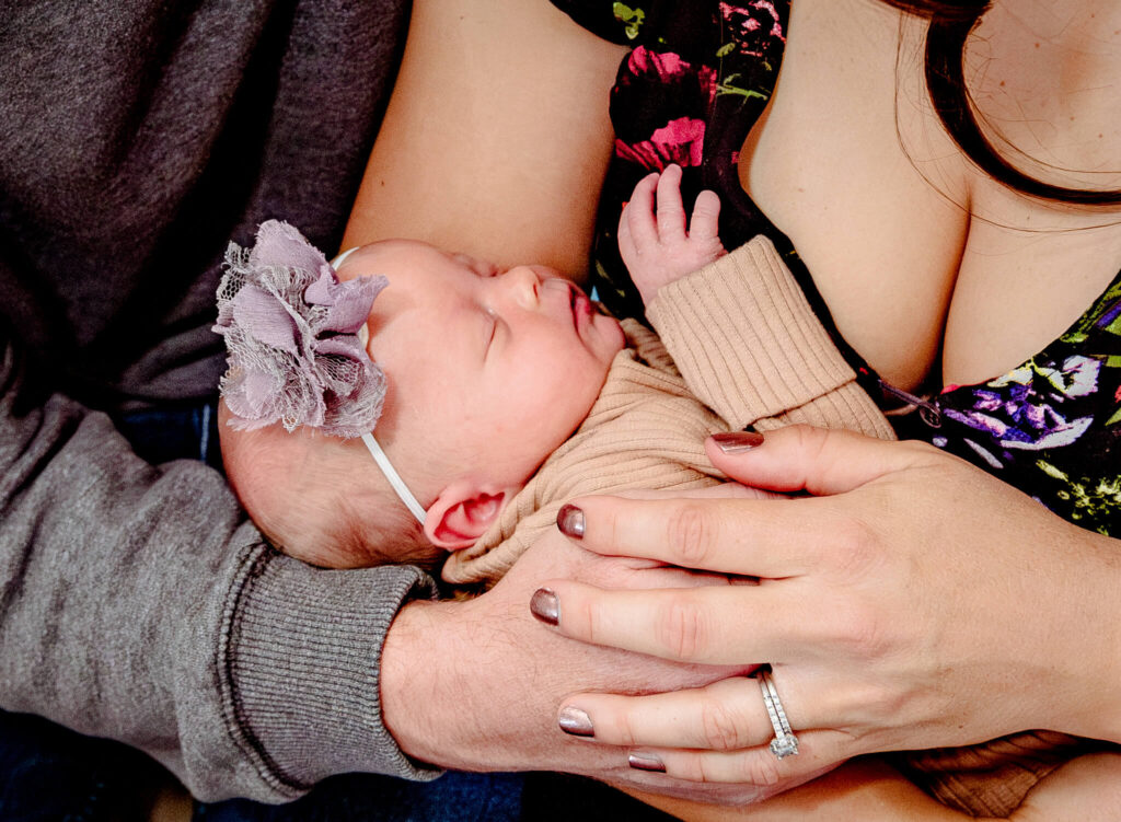 parents looking for lactation consultant in Phoenix, holding new daughter