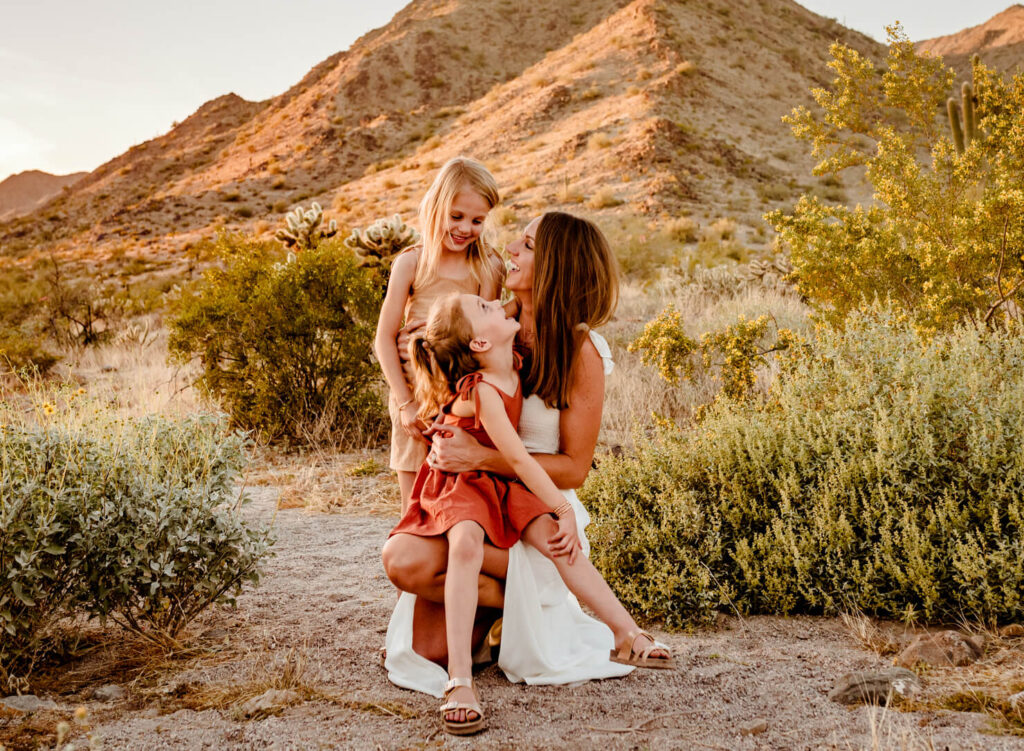 Mom looking for spas in Peoria, photographed with her two daughters in the desert by Cactus & Pine Photography