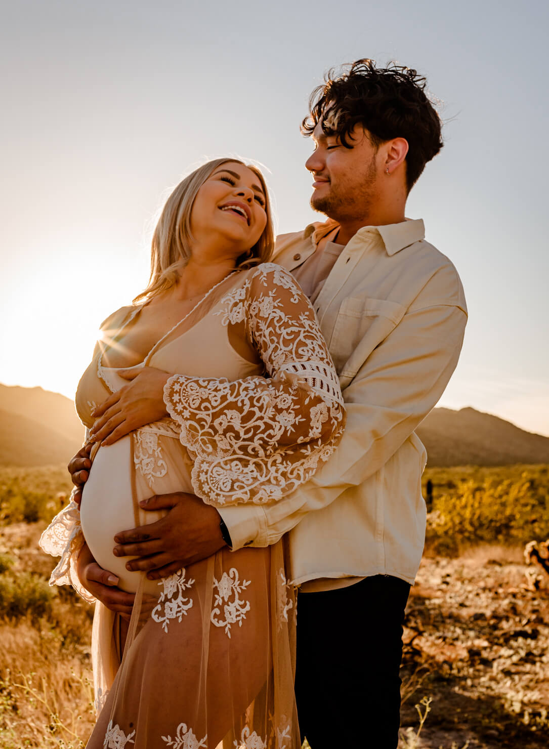 parents to be at their maternity session, sharing how they found arizona midwives