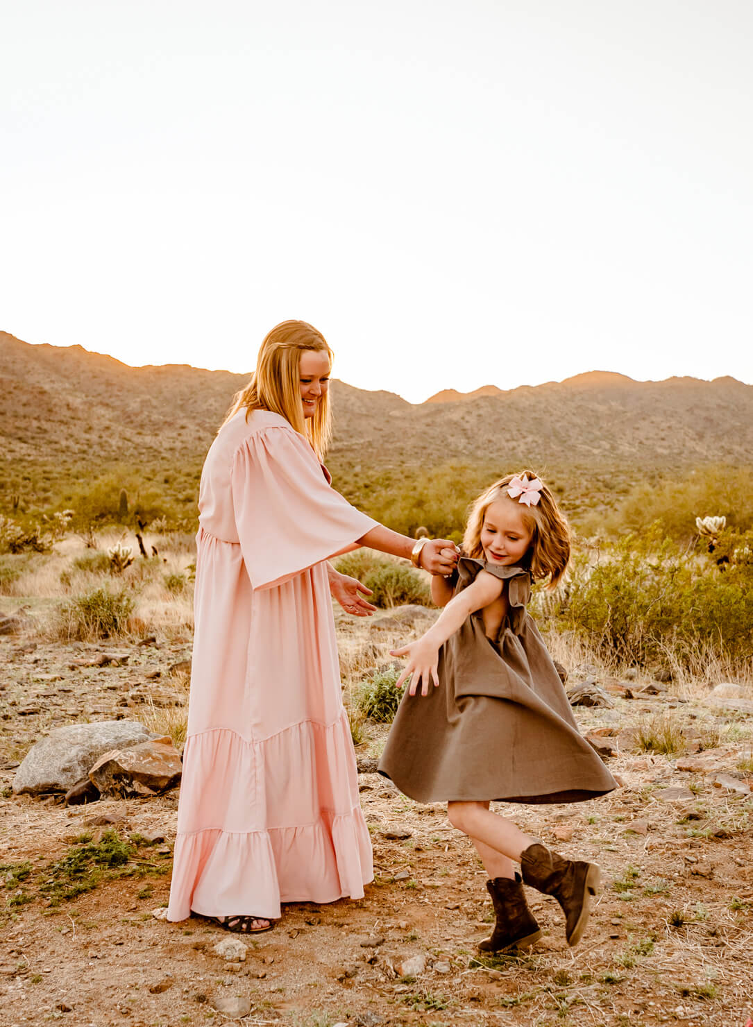 mom with her young daughter who is looking to for family hand casting in Phoenix