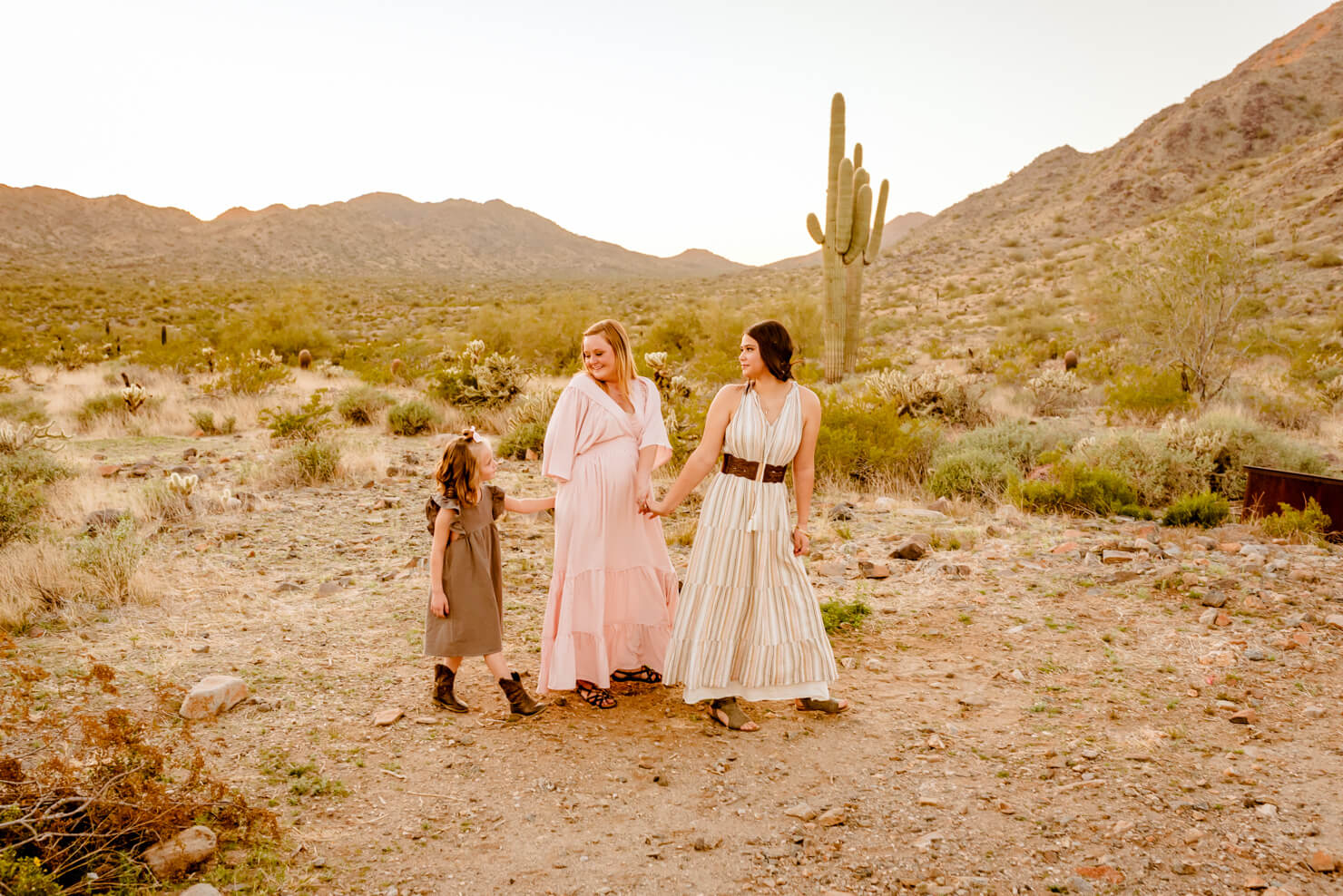 Mom and her daughters taking portraits before getting a Phoenix family hand casting session