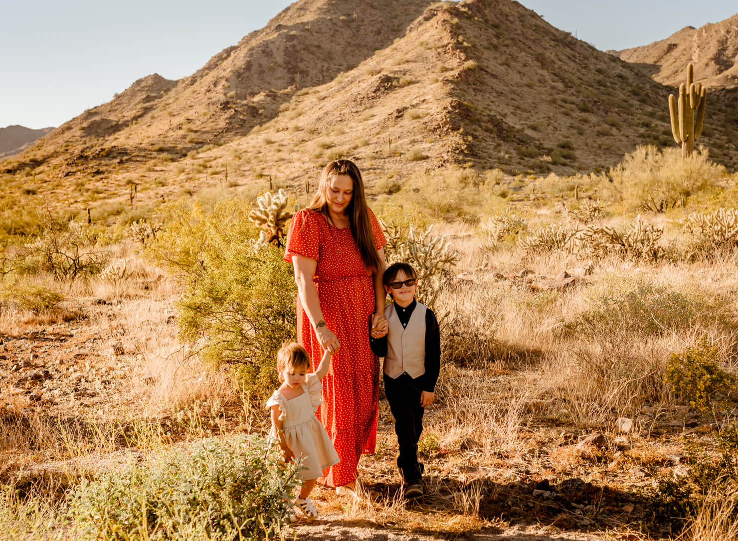 mom and her two young kids in she plans to take to Phoenix for a family hand casting