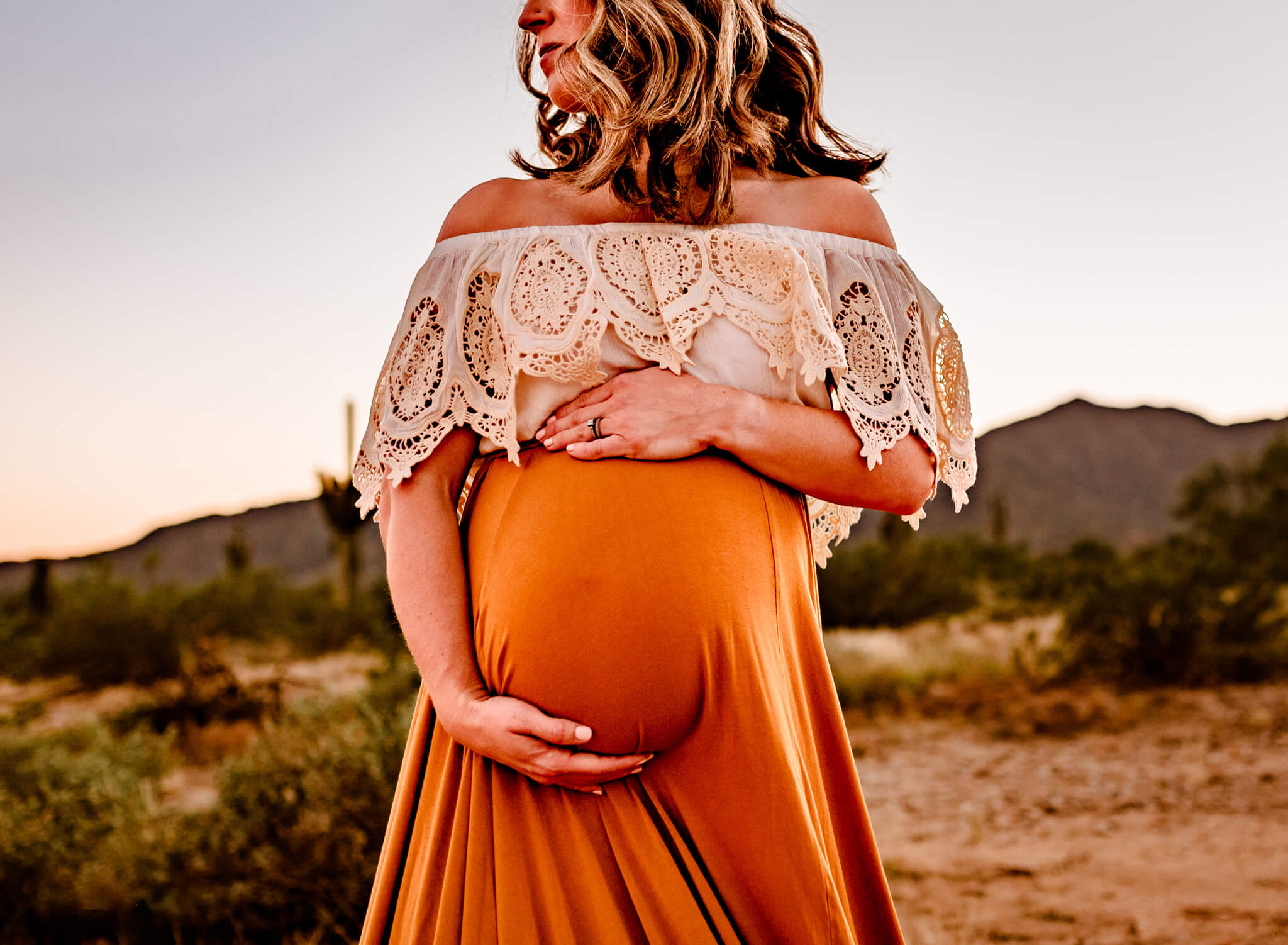 Mom holding baby bump in Phoenix, near Maternity Keepsake