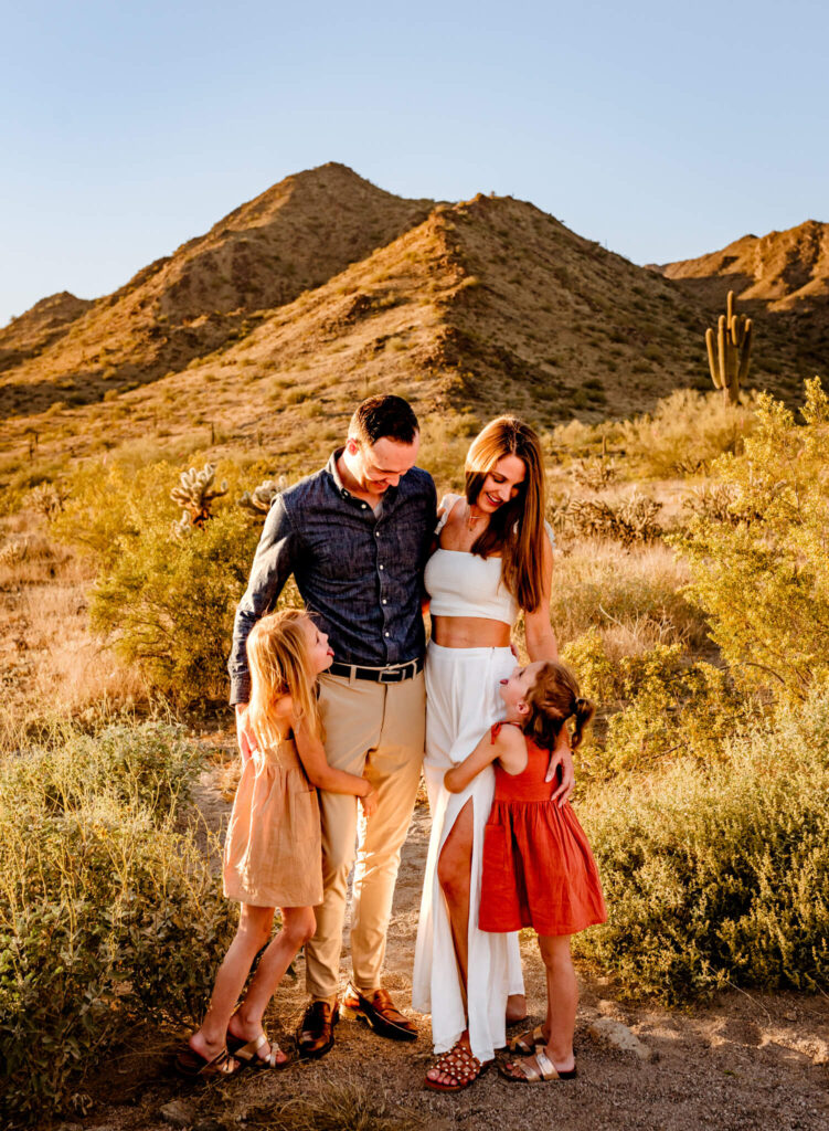 family hugging during family session with surprise az family photographer