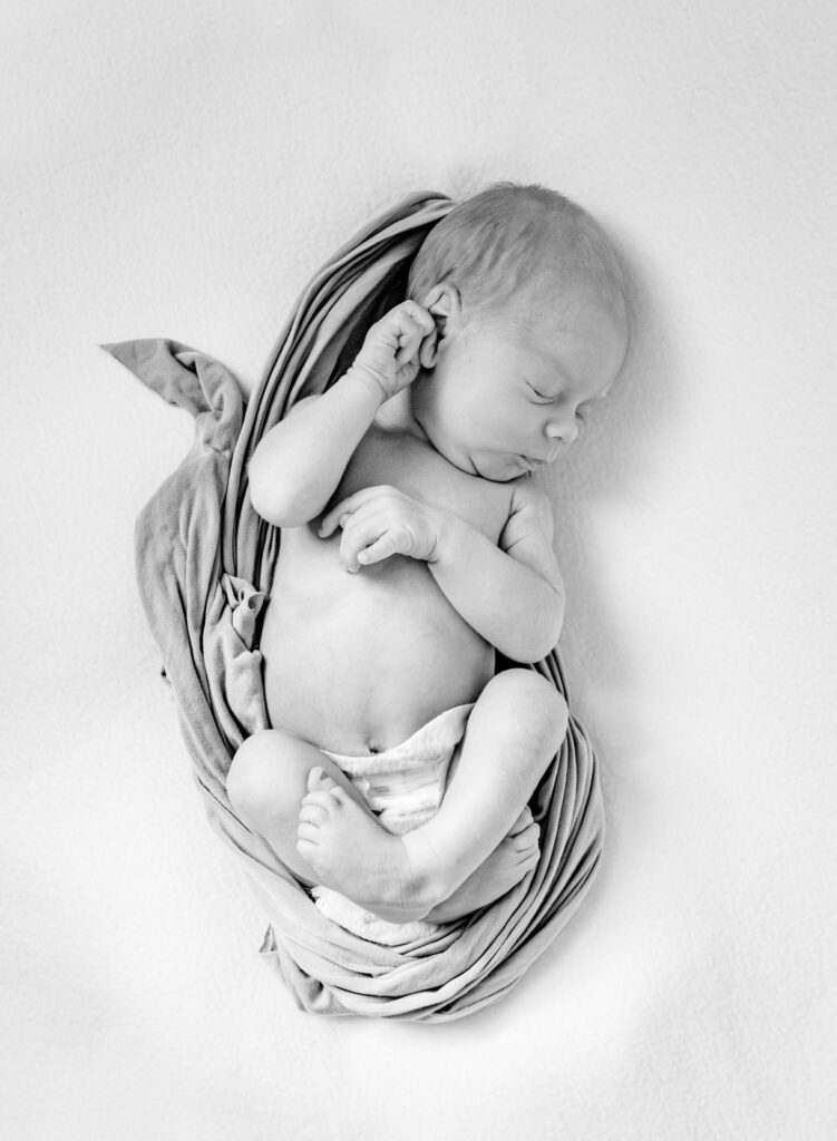 photography business coach helped with this photo of newborn in a blanket