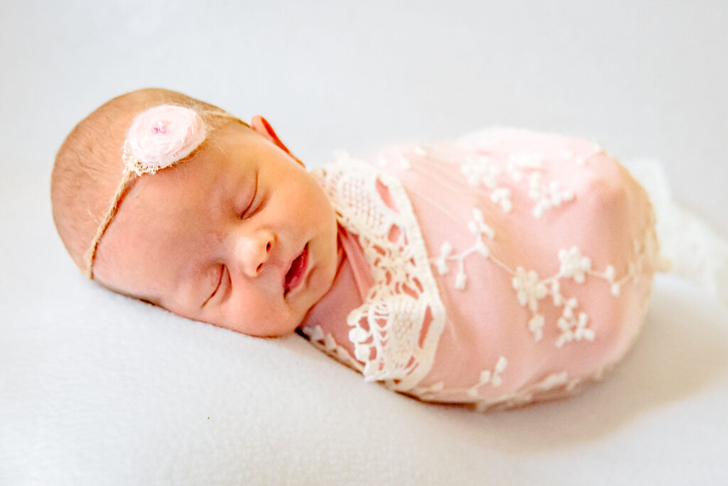 professional newborn photo taken by photographer who hired a business coach