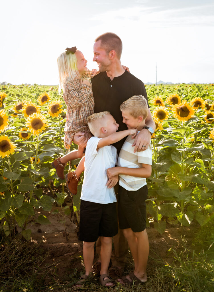 dad playing with kids at sunflower field in phoenix, az fall festival
