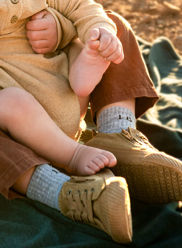 Details photo of kids' toes for portrait session at a christmas tree farm in arizona taken by Cactus & Pine Photography